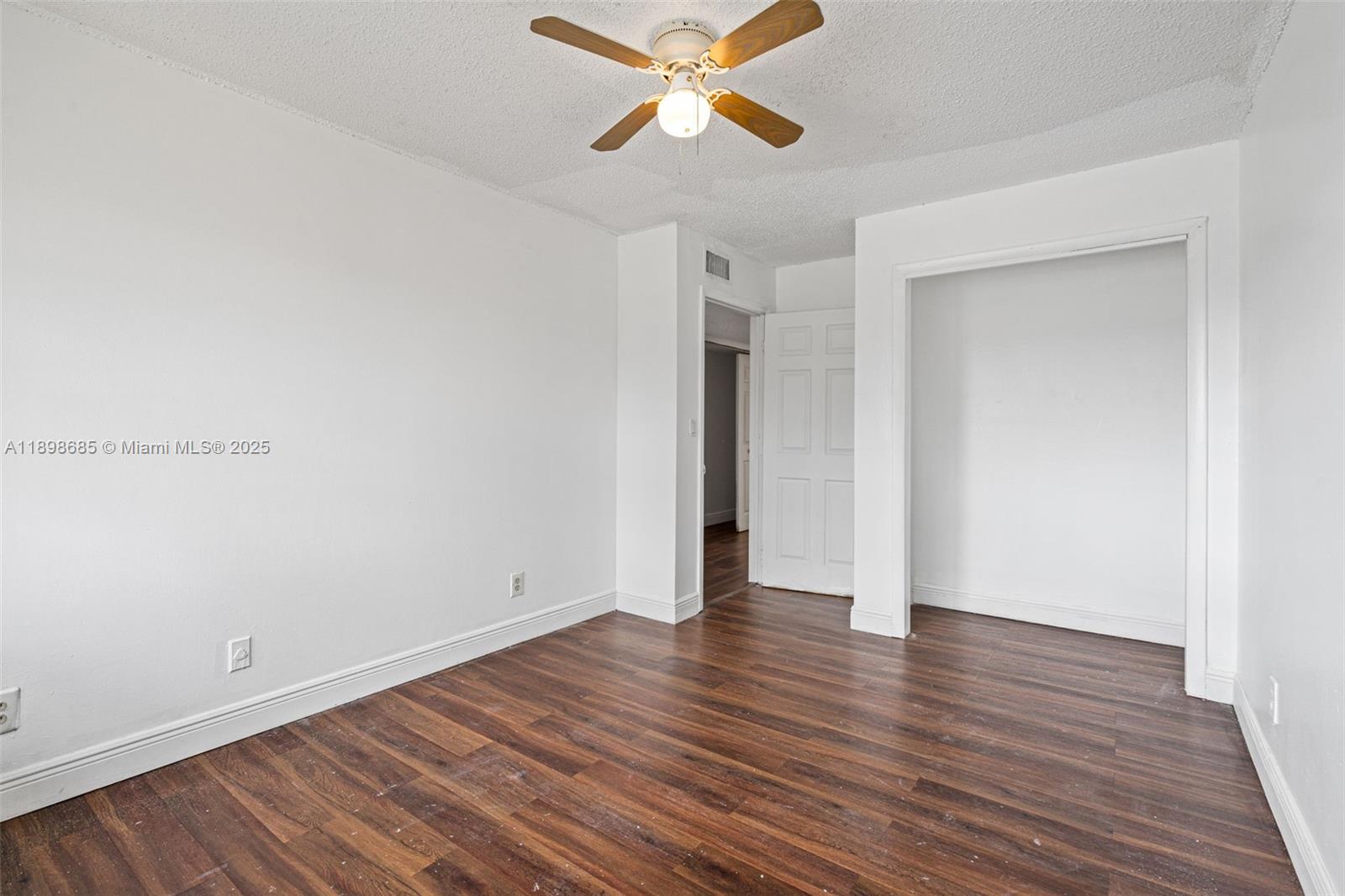 941 Southwest 20th Court Delray Beach, FL 33445 - Photo 25 of 46 a view of empty room with wooden floor