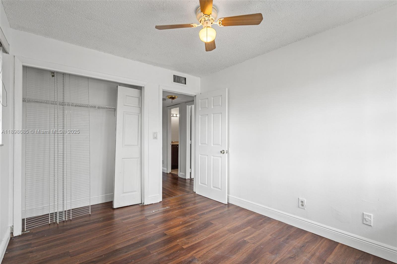 941 Southwest 20th Court Delray Beach, FL 33445 - Photo 29 of 46 a view of an empty room with wooden floor