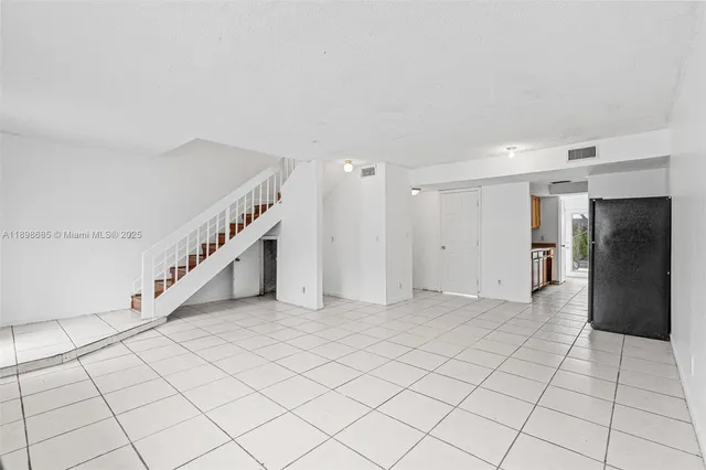 a view of an entryway with white walls