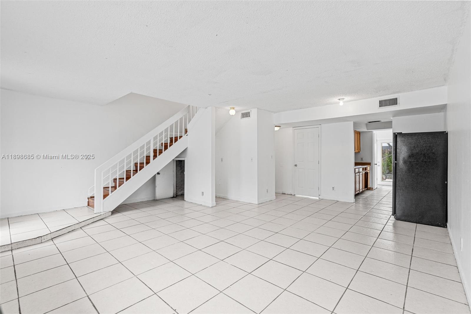 941 Southwest 20th Court Delray Beach, FL 33445 - Photo 4 of 46 a view of an entryway with white walls