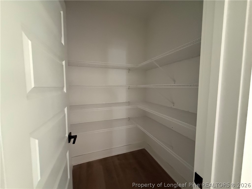 132 Ridge Stone Drive Autryville, NC 28318 - Photo 17 of 26 a view of walk in closet with empty racks