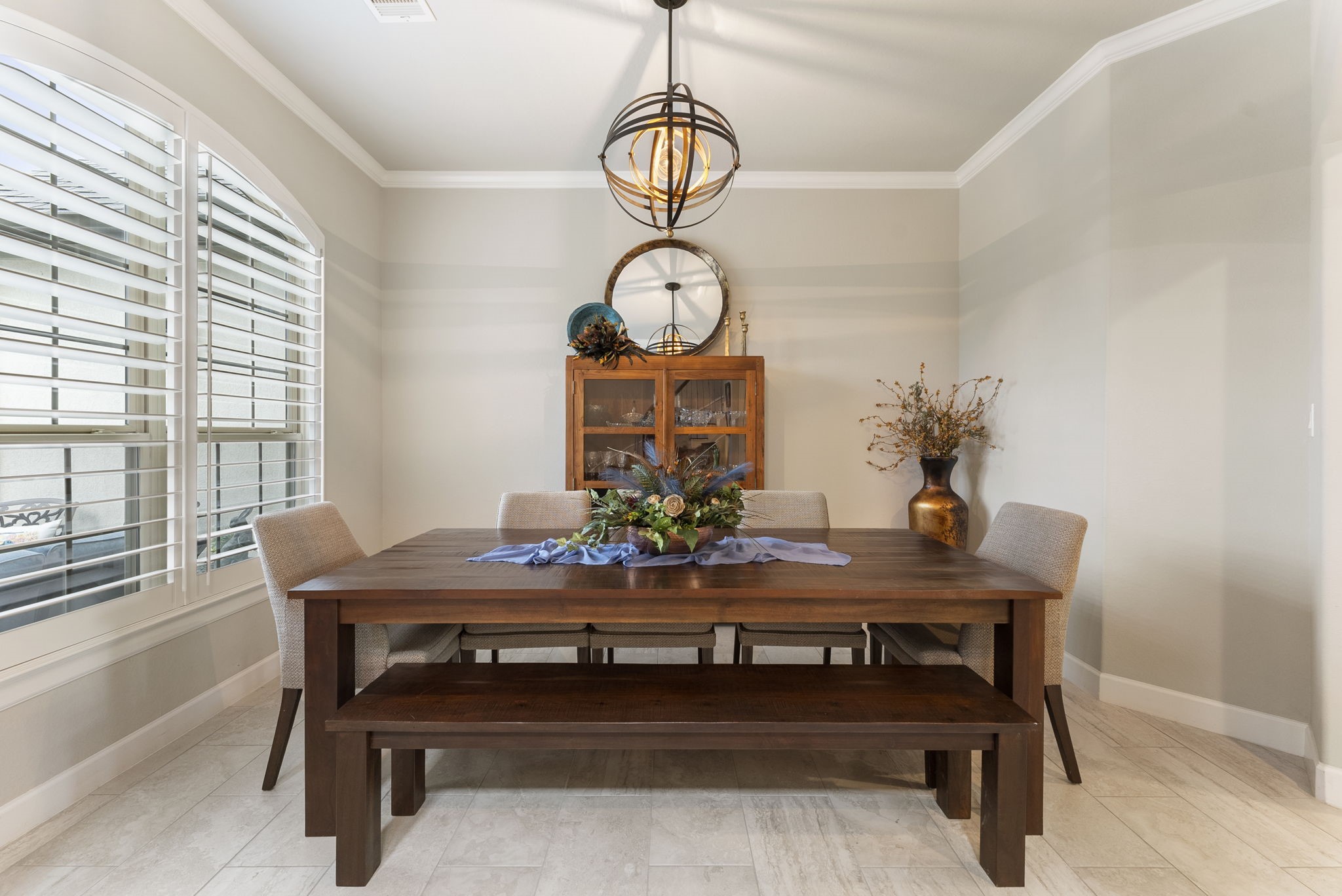 25607 Muirfield Bend Court Spring, TX 77389 - Photo 6 of 30 Dedicated dining room featuring abundant natural light, designer lighting, and a warm, inviting atmosphere ideal for both intimate dinners and larger gatherings.