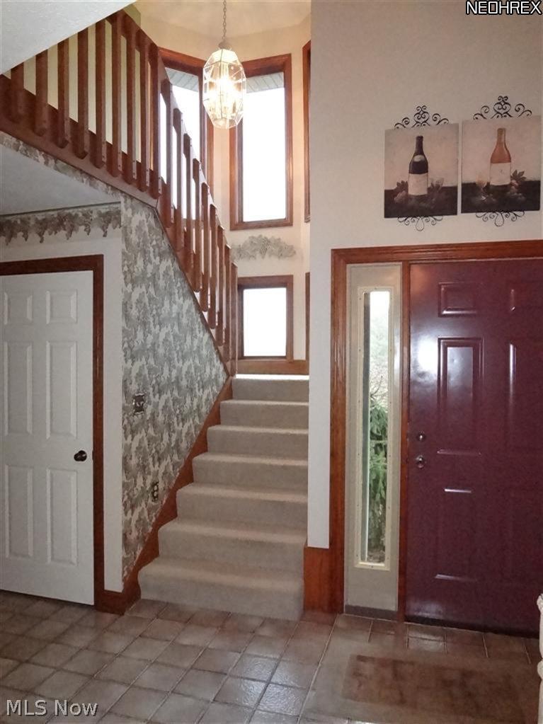 3306 Fox Road Sandusky, OH 44870 - Photo 10 of 25 Front foyer, door on the left goes to full finished basement.
