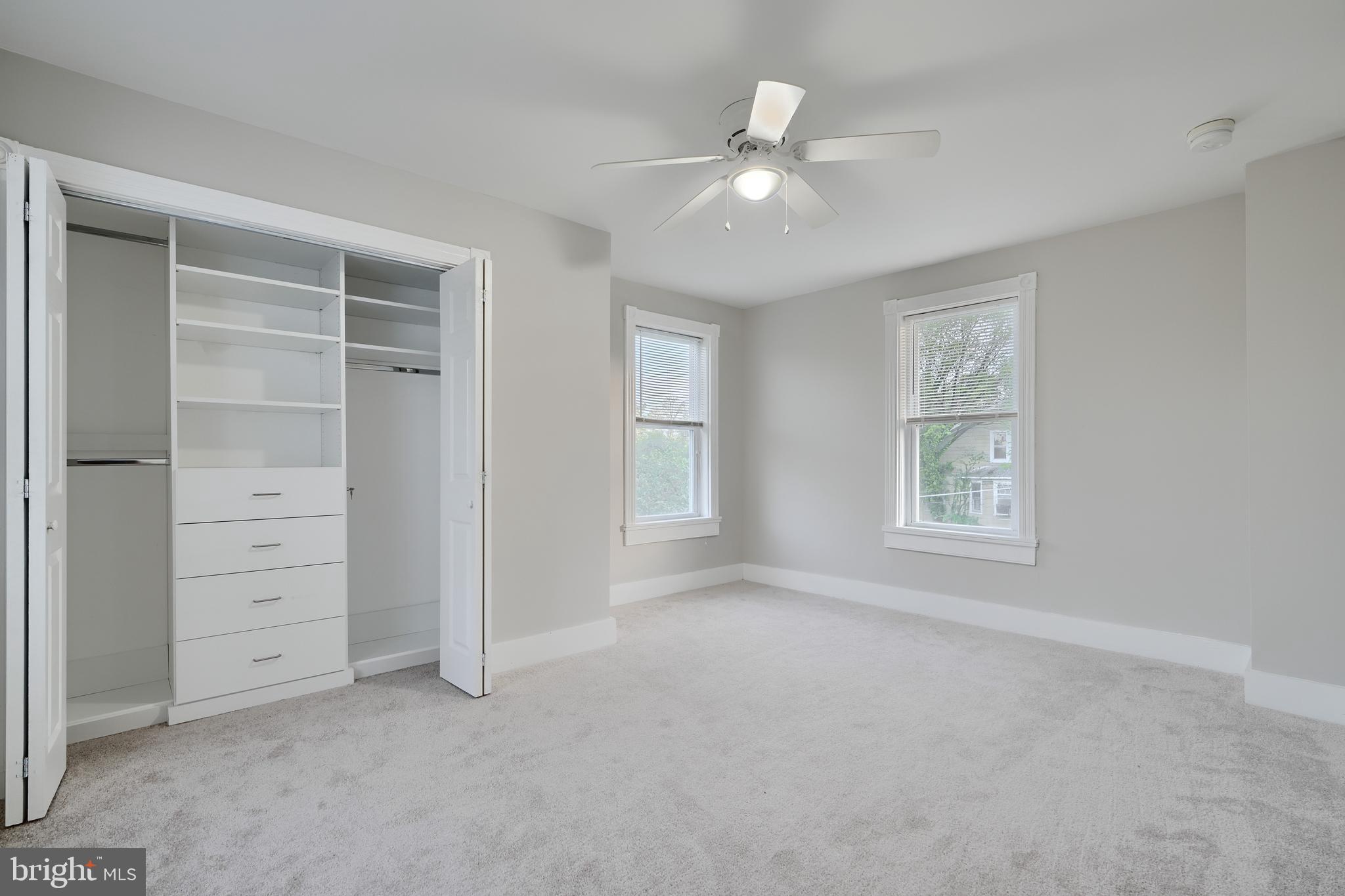 1817 Summit Avenue Baltimore, MD 21227 - Photo 14 of 28 an empty room with windows and closet