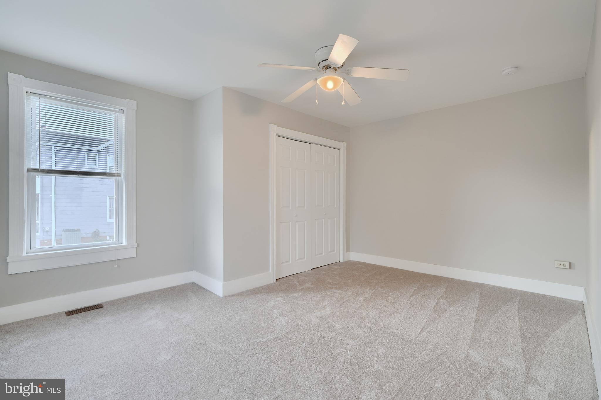 1817 Summit Avenue Baltimore, MD 21227 - Photo 15 of 28 an empty room with a window