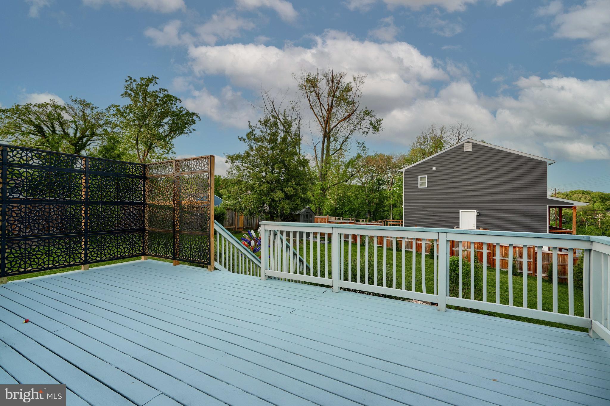 1817 Summit Avenue Baltimore, MD 21227 - Photo 21 of 28 a view of a deck with a yard