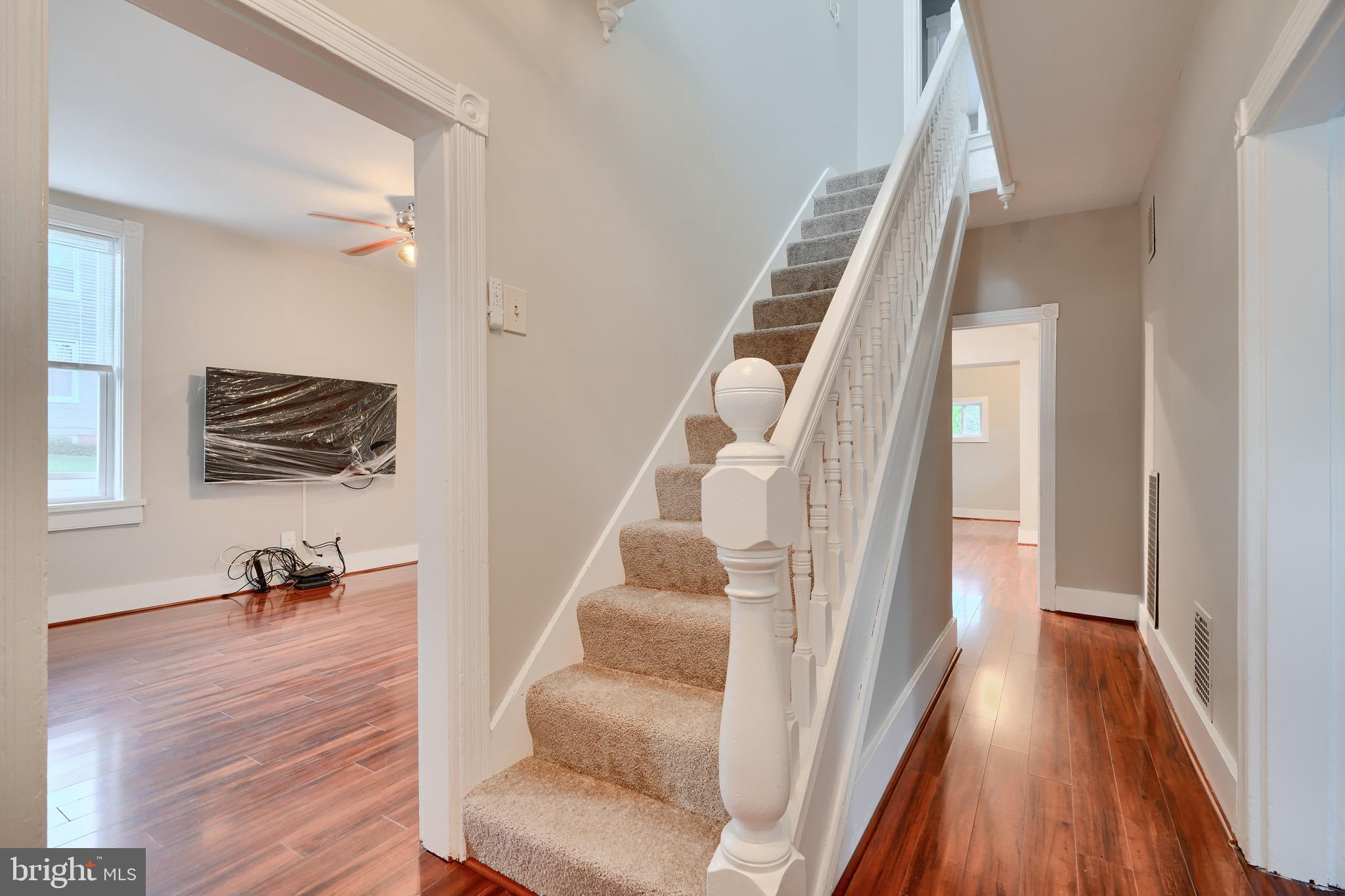 1817 Summit Avenue Baltimore, MD 21227 - Photo 10 of 28 a view of entryway and hall with wooden floor