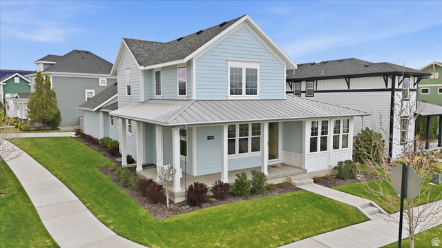5488 West Copper Needle Way South Jordan, UT 84009 - Photo 1 of 1 View of front of house with covered porch.