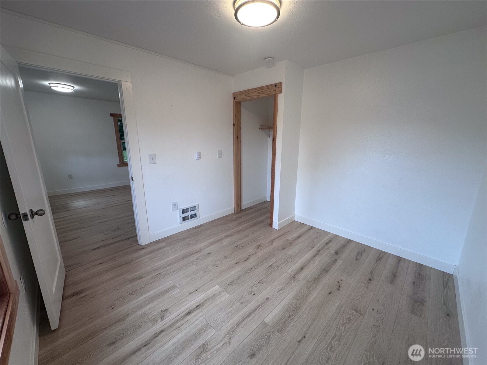 10341 184th Avenue Southwest Rochester, WA 98579 - Photo 10 of 36 a view of a hallway with wooden floor