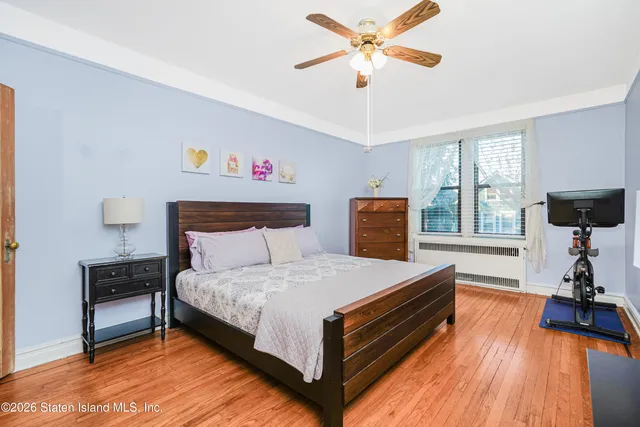 a bedroom with a bed and a table