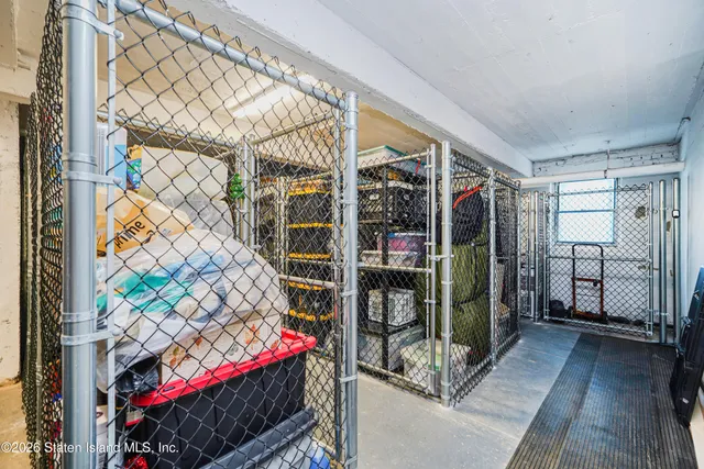 a view of a room with wooden floor and windows