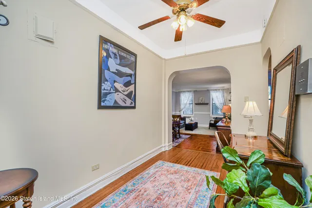 a living room with a couch and a chandelier