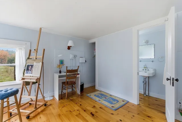 a bed room with a bed and a chair