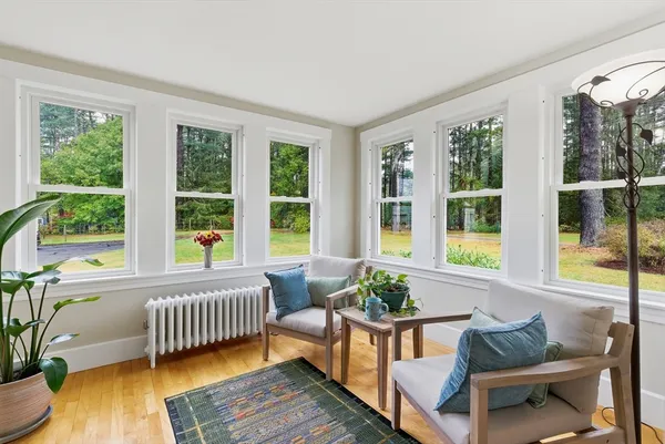 a bedroom with furniture and a window