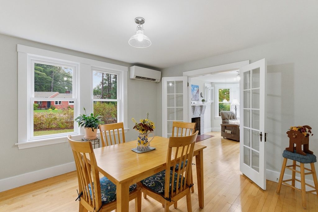 295 Vaughn Hill Road Bolton, MA 01740 - Photo 21 of 38 a view of a dining room with furniture window and wooden floor