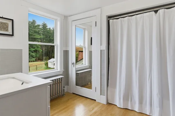a view of a bathroom with a tub and sink