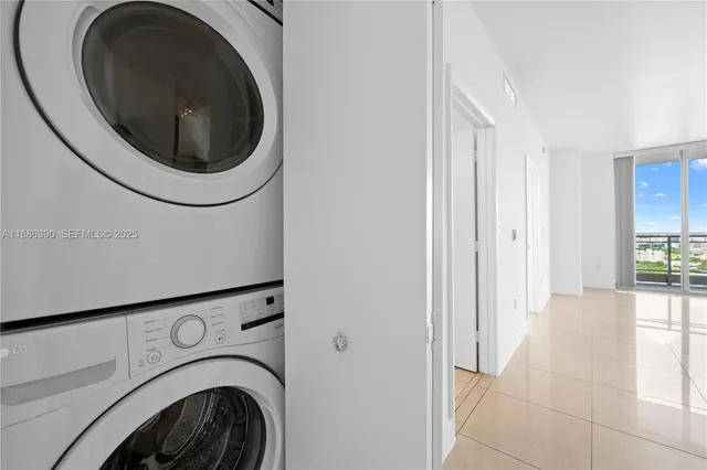 a view of a hallway with washer and dryer