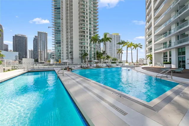 a view of swimming pool with outdoor seating