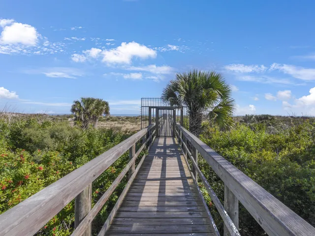 a view of a balcony with wooden stairs