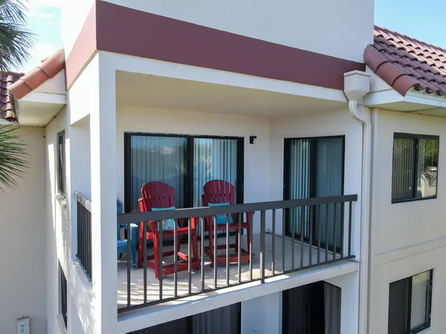 a view of a city with lush green forest