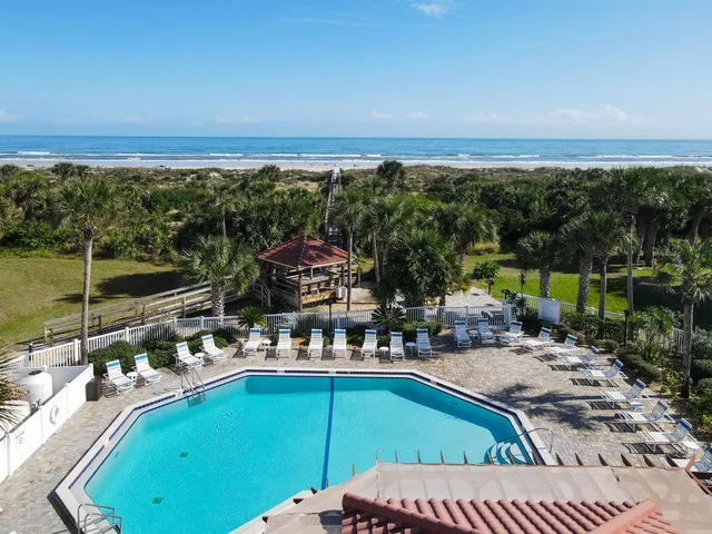 a view of a swimming pool with a patio