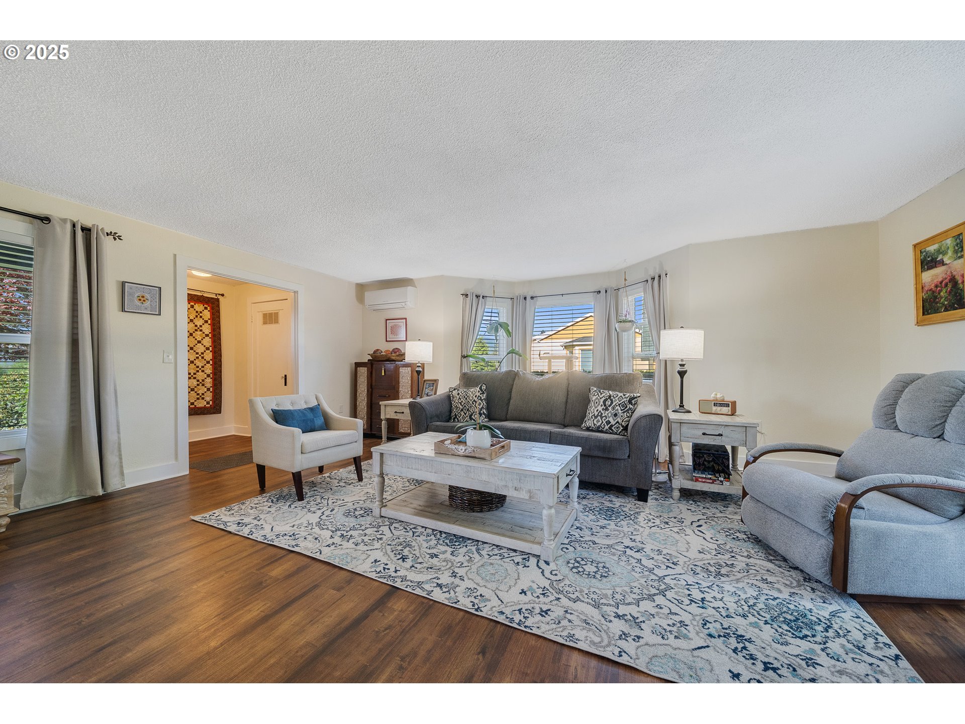 6355 Long Prairie Road Tillamook, OR 97141 - Photo 21 of 34 a living room with furniture wooden floor and a window