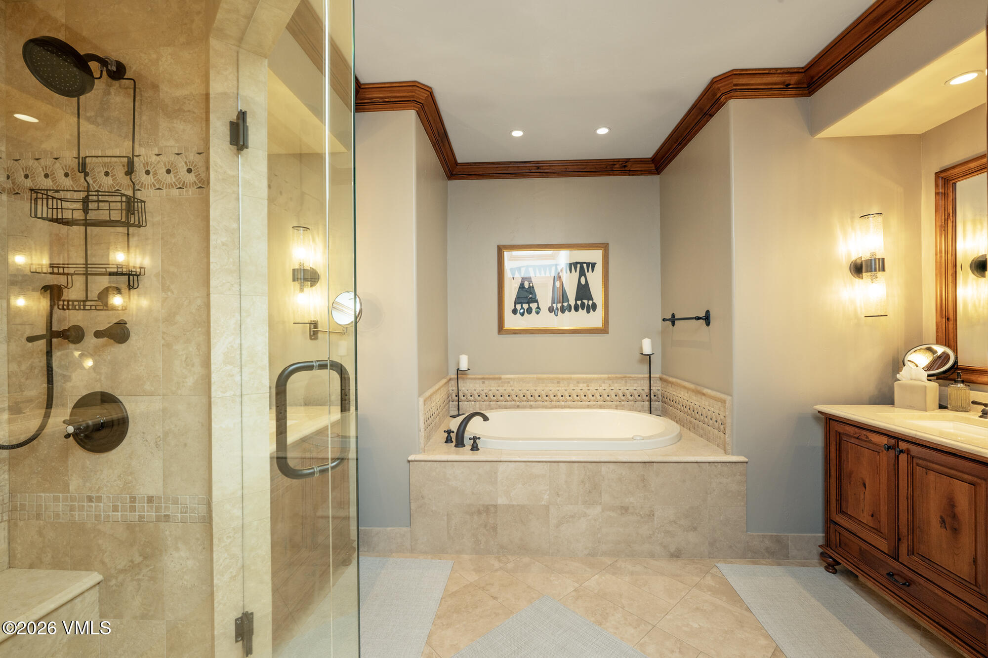 325 West Forest Road Vail, CO 81657 - Photo 14 of 33 a bathroom with a tub a sink and mirror
