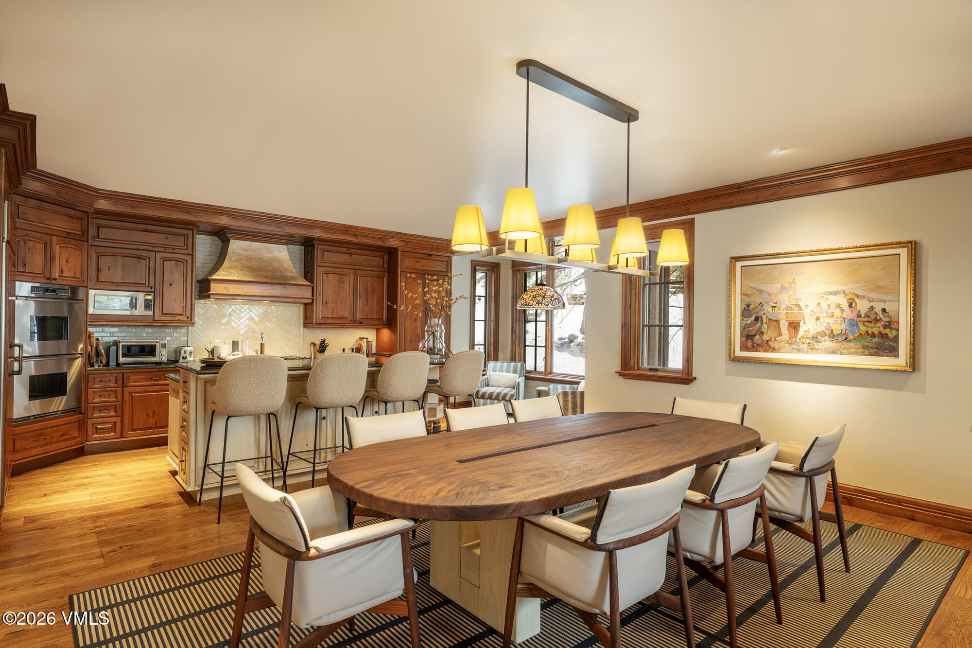 325 West Forest Road Vail, CO 81657 - Photo 8 of 33 a dining room with chairs and wooden floor