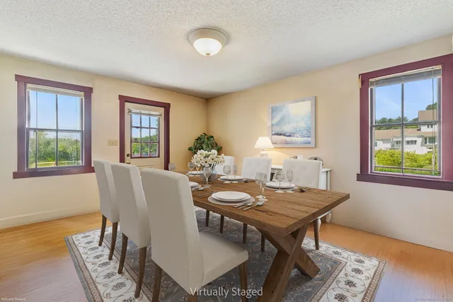 a dining room with furniture and window