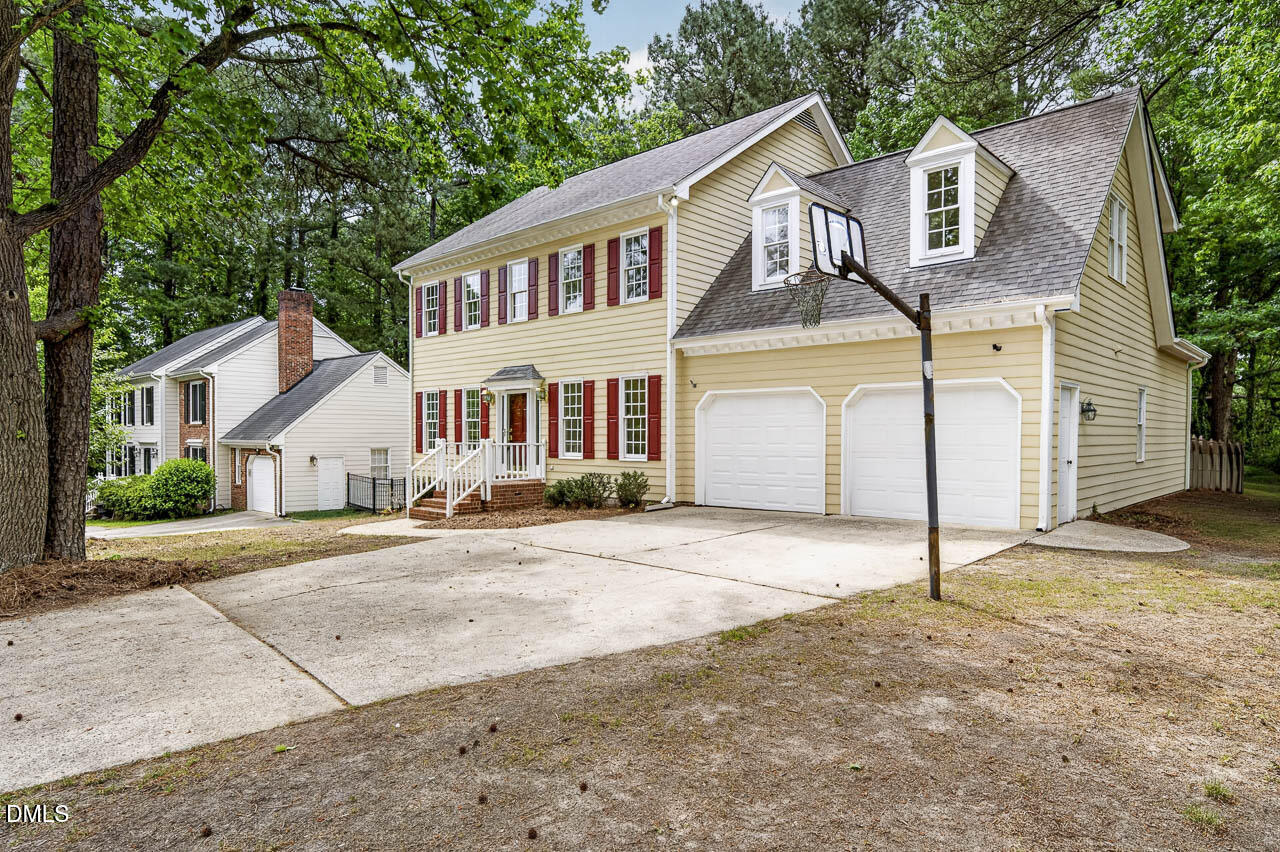 2209 Lodestar Drive Raleigh, NC 27615 - Photo 3 of 50 a front view of a house with a yard and garage