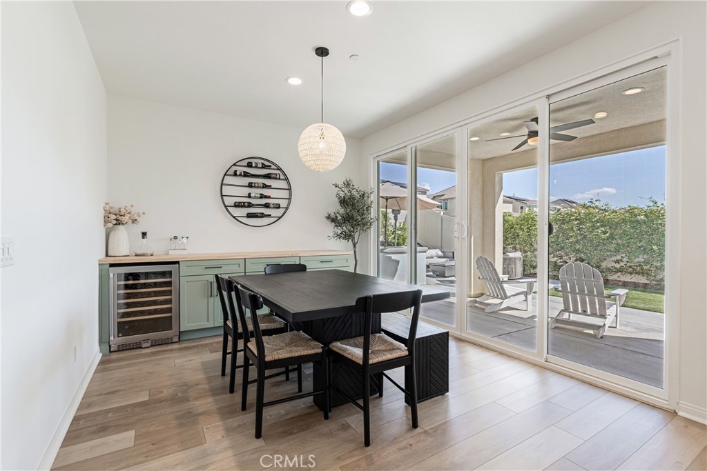 32067 Dawning Ridge Temecula, CA 92591 - Photo 13 of 73 a view of a dining room and livingroom with furniture wooden floor a rug a chandelier and a rug