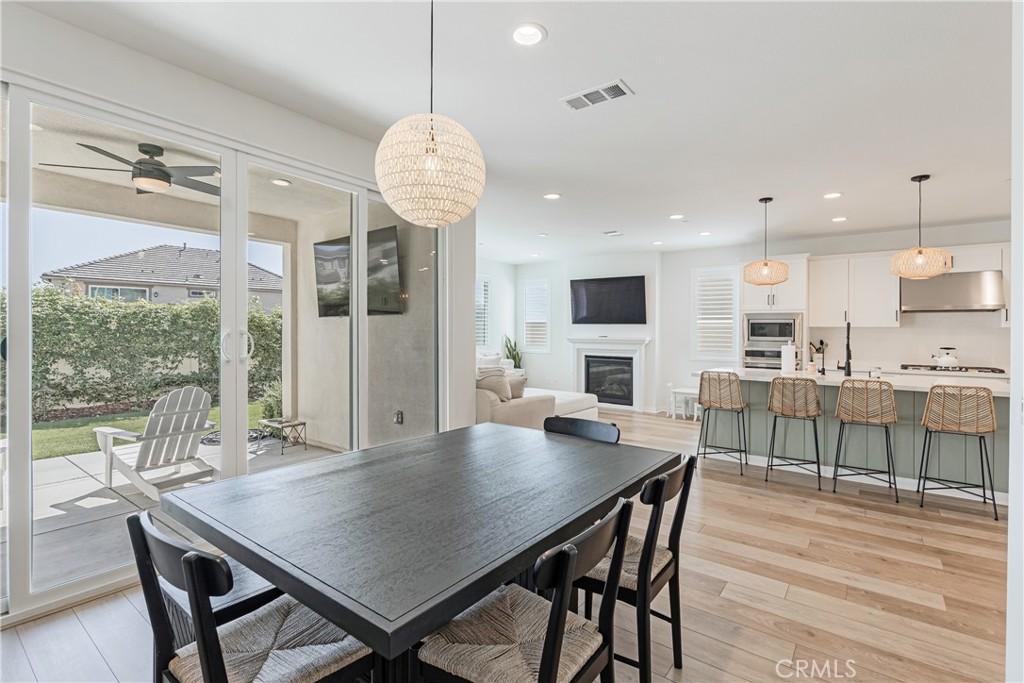 32067 Dawning Ridge Temecula, CA 92591 - Photo 14 of 73 a view of a dining room with furniture window and wooden floor