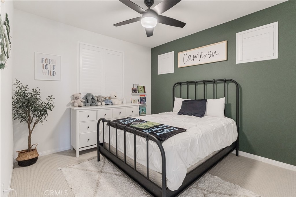 32067 Dawning Ridge Temecula, CA 92591 - Photo 15 of 73 a bedroom with a bed and a potted plant