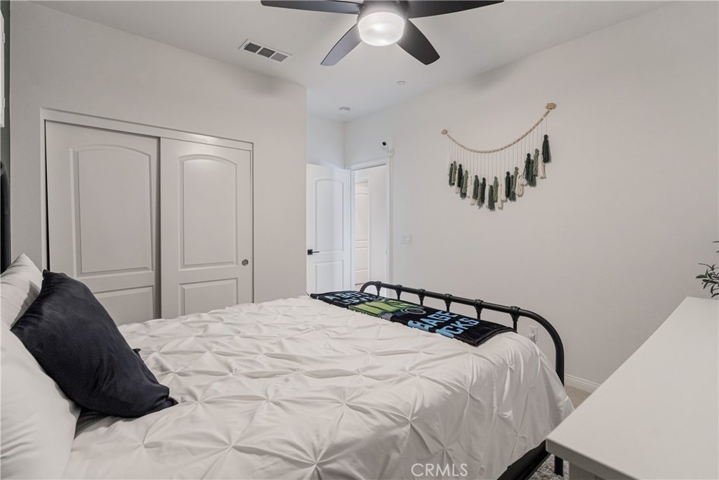 32067 Dawning Ridge Temecula, CA 92591 - Photo 16 of 73 a bedroom with a bed and a chandelier