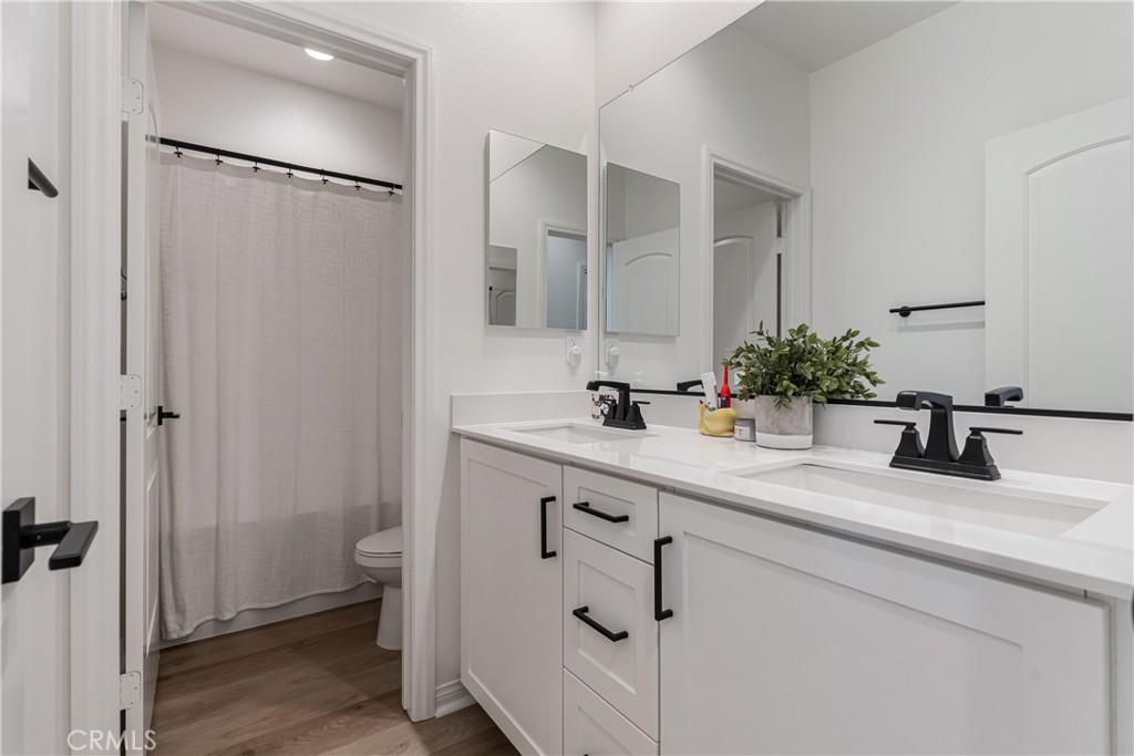 32067 Dawning Ridge Temecula, CA 92591 - Photo 17 of 73 a bathroom with a sink and a mirror