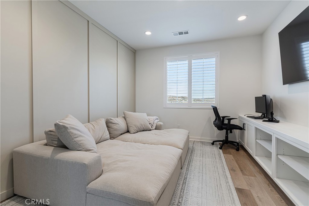 32067 Dawning Ridge Temecula, CA 92591 - Photo 19 of 73 a living room with furniture a flat screen tv and a window