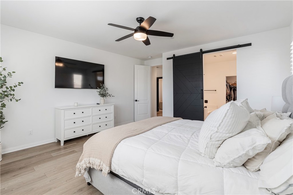 32067 Dawning Ridge Temecula, CA 92591 - Photo 23 of 73 a bedroom with a bed and a flat screen tv