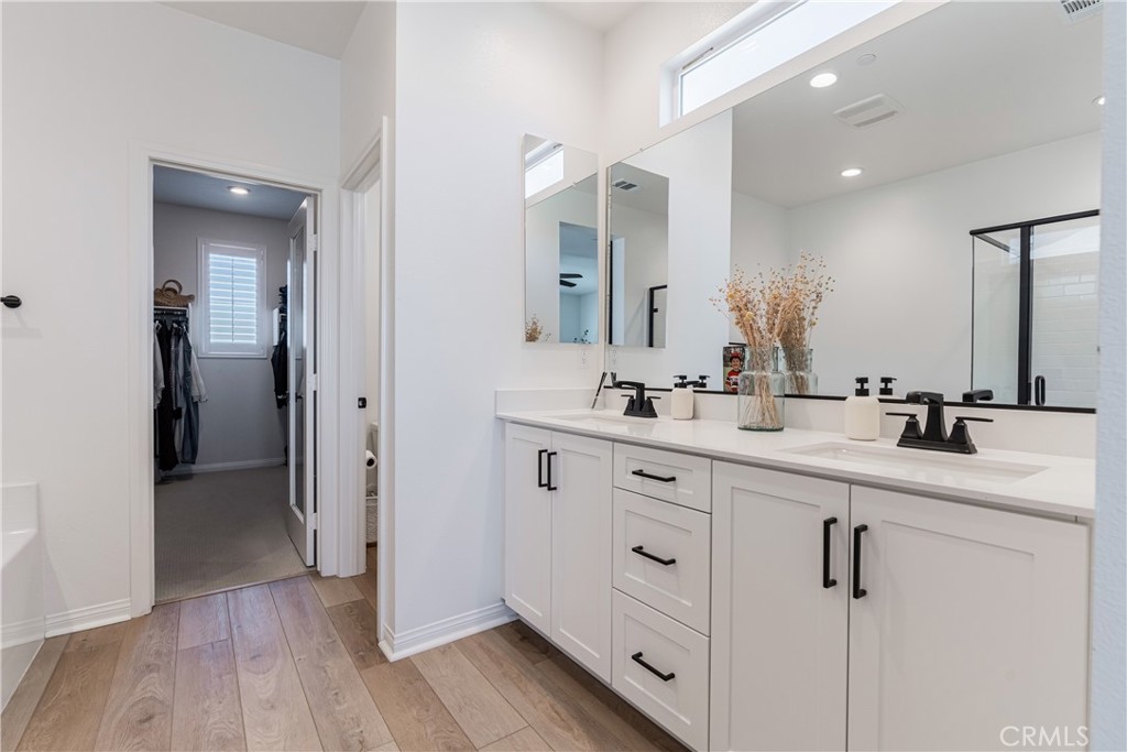32067 Dawning Ridge Temecula, CA 92591 - Photo 25 of 73 a bathroom with a double vanity sink mirror and toilet