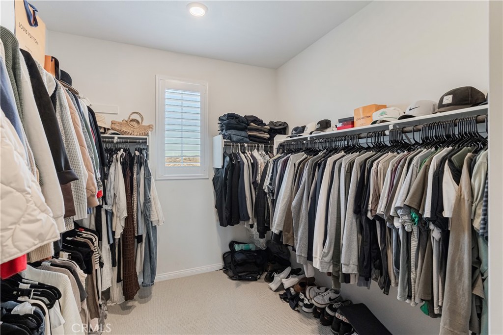 32067 Dawning Ridge Temecula, CA 92591 - Photo 27 of 73 a view of walk in closet with clothes
