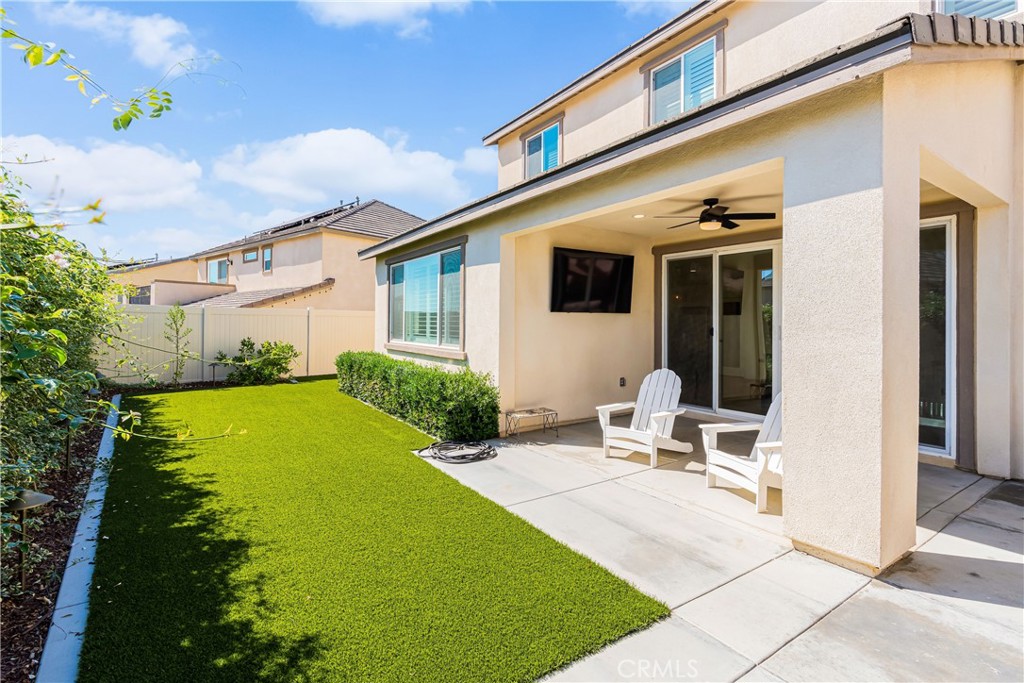 32067 Dawning Ridge Temecula, CA 92591 - Photo 38 of 73 a view of a patio with table and chairs potted plants and large tree