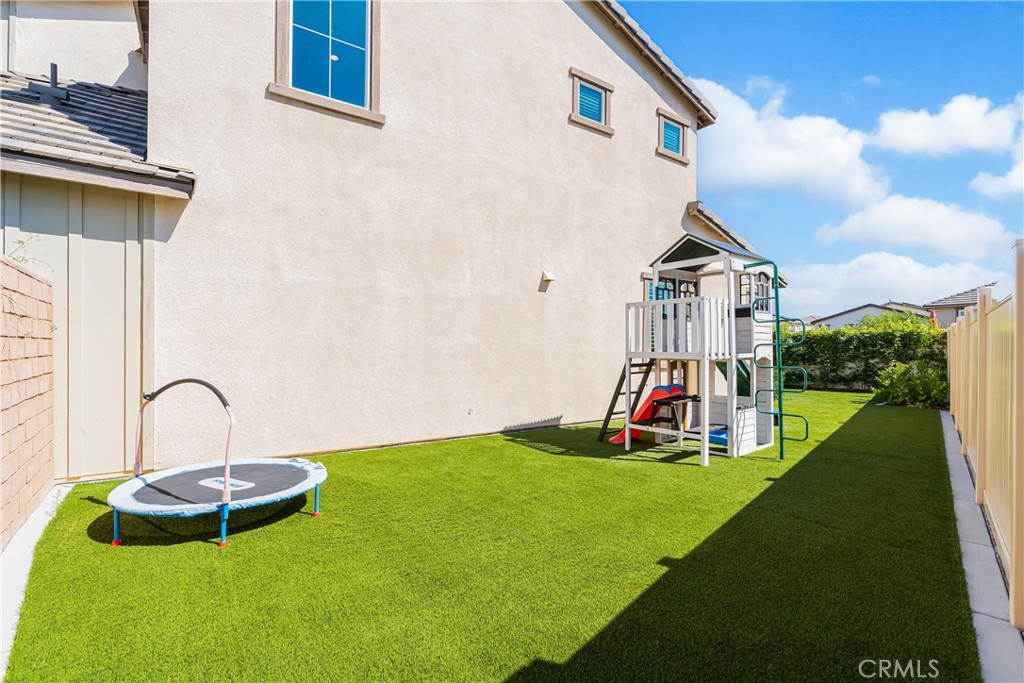 32067 Dawning Ridge Temecula, CA 92591 - Photo 42 of 73 a view of a backyard with a slide and plants