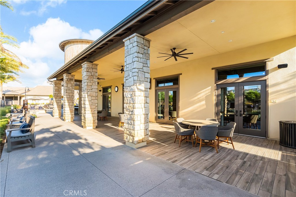 32067 Dawning Ridge Temecula, CA 92591 - Photo 50 of 73 a view of a patio with table and chairs and wooden floor