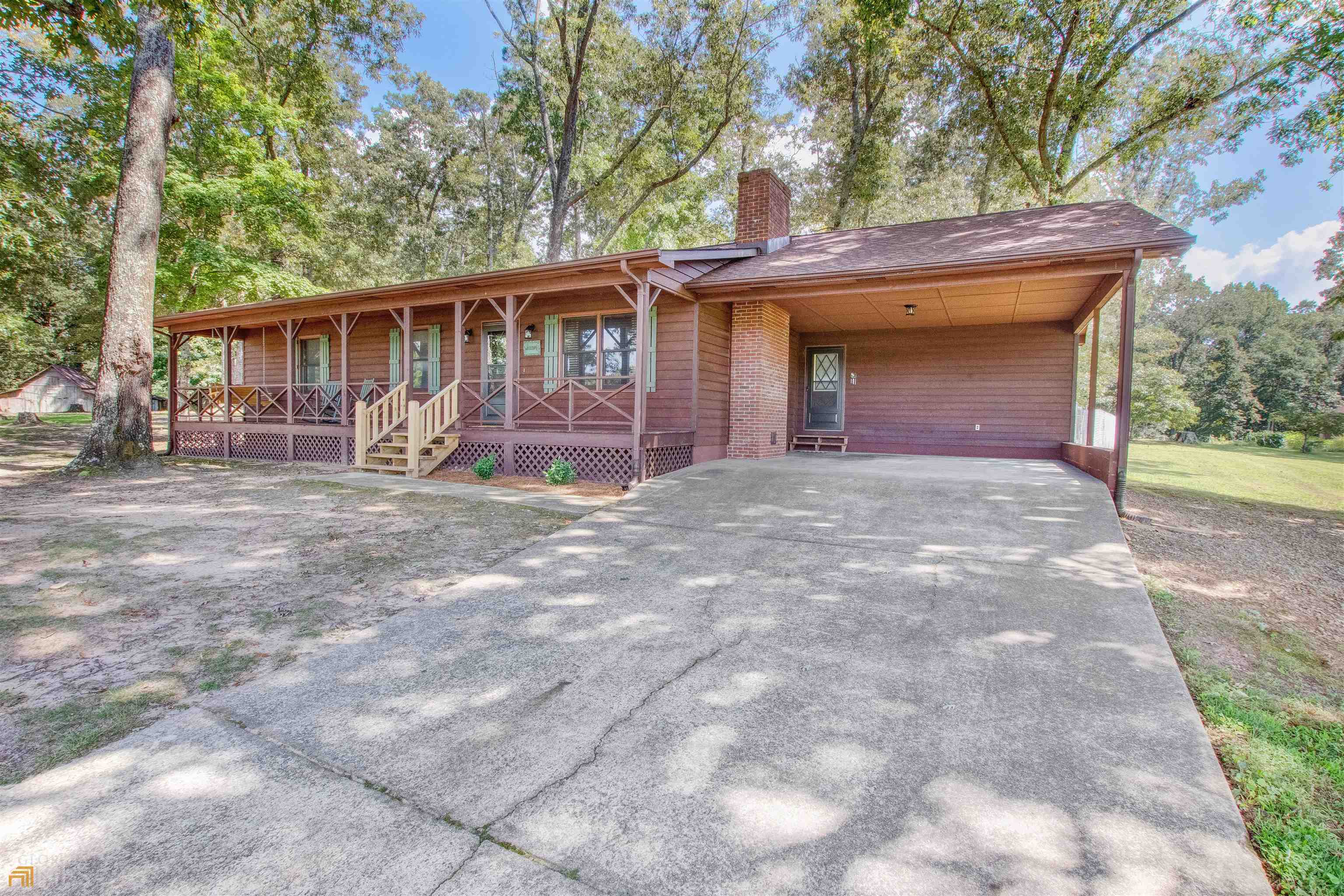 422 Thacker Road Clarkesville, GA 30523 - Photo 1 of 1 a front view of a house with yard and trees around