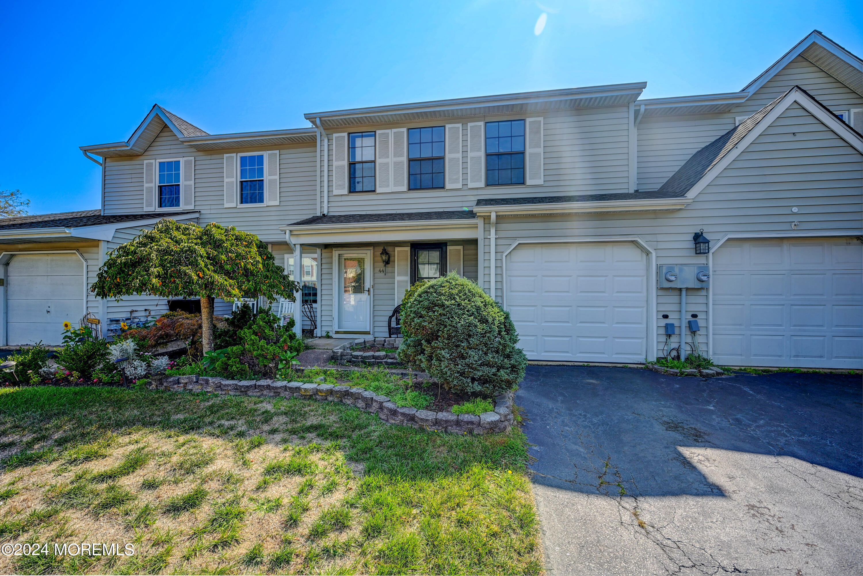 44 Mariners Cove Freehold, NJ 07728 - Photo 1 of 38 a front view of a house with garden