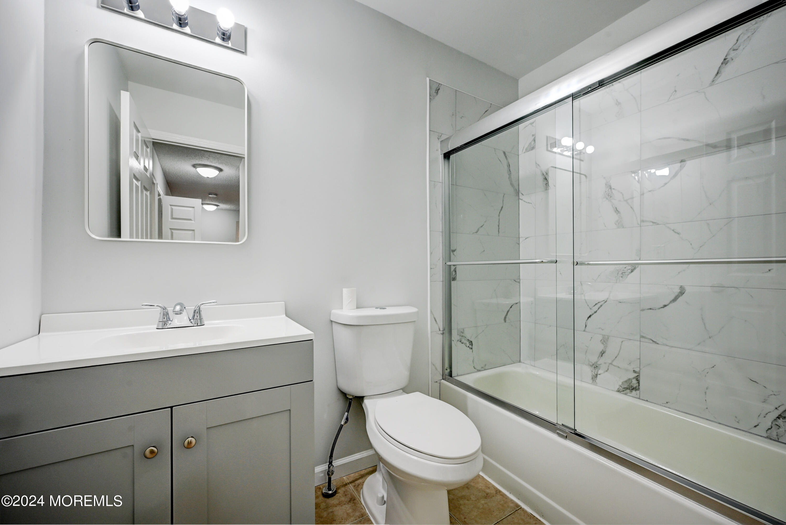 44 Mariners Cove Freehold, NJ 07728 - Photo 26 of 38 a bathroom with a sink toilet and shower