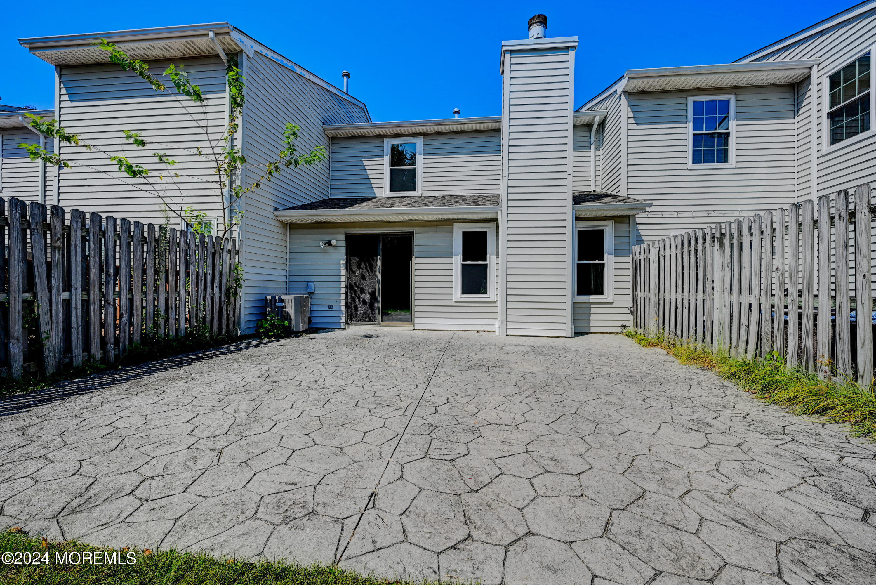 44 Mariners Cove Freehold, NJ 07728 - Photo 36 of 38 a front view of a house with a yard and garage