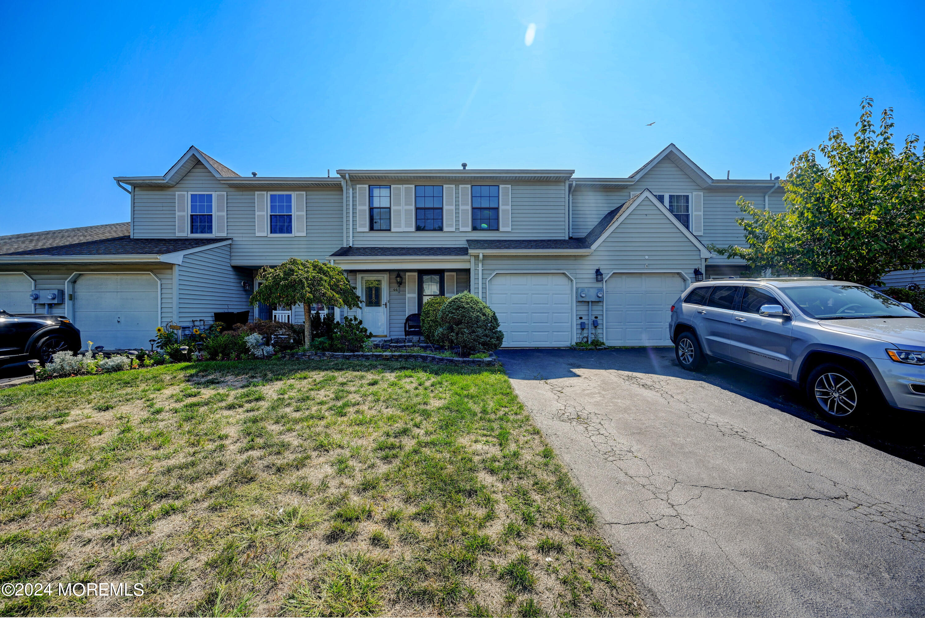 44 Mariners Cove Freehold, NJ 07728 - Photo 4 of 38 a house view with a garden space