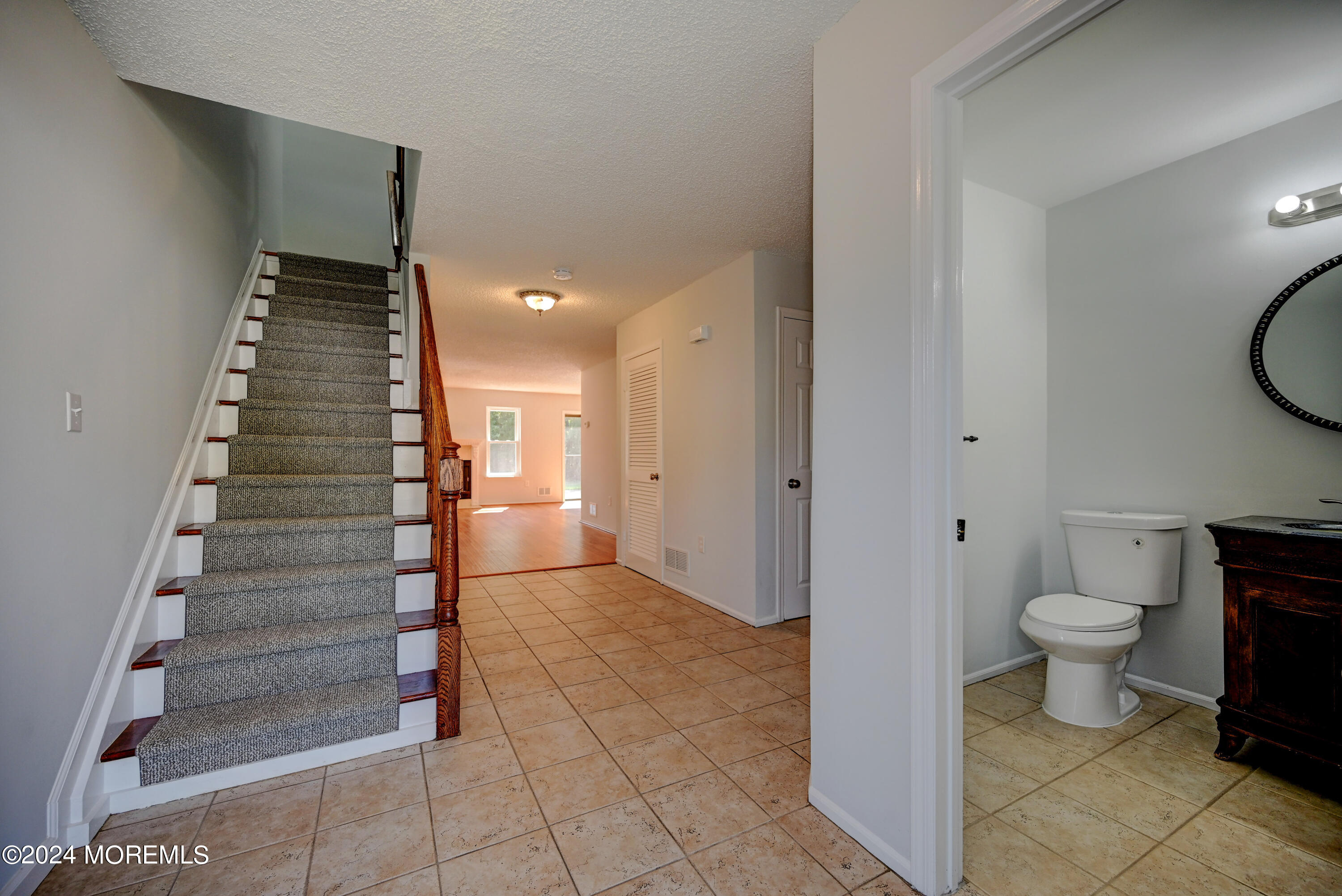 44 Mariners Cove Freehold, NJ 07728 - Photo 5 of 38 a view of a hallway with stairs and a toilet
