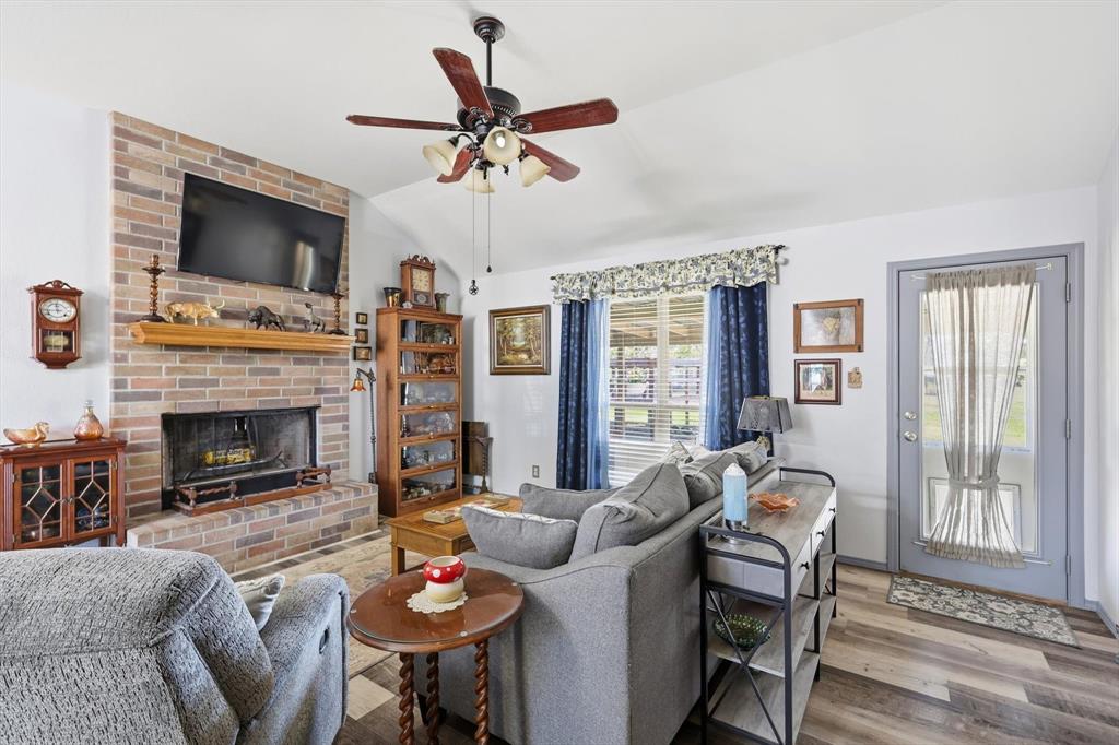 11649 Mitchell Circle Ponder, TX 76259 - Photo 12 of 38 a living room with furniture fireplace and flat screen tv