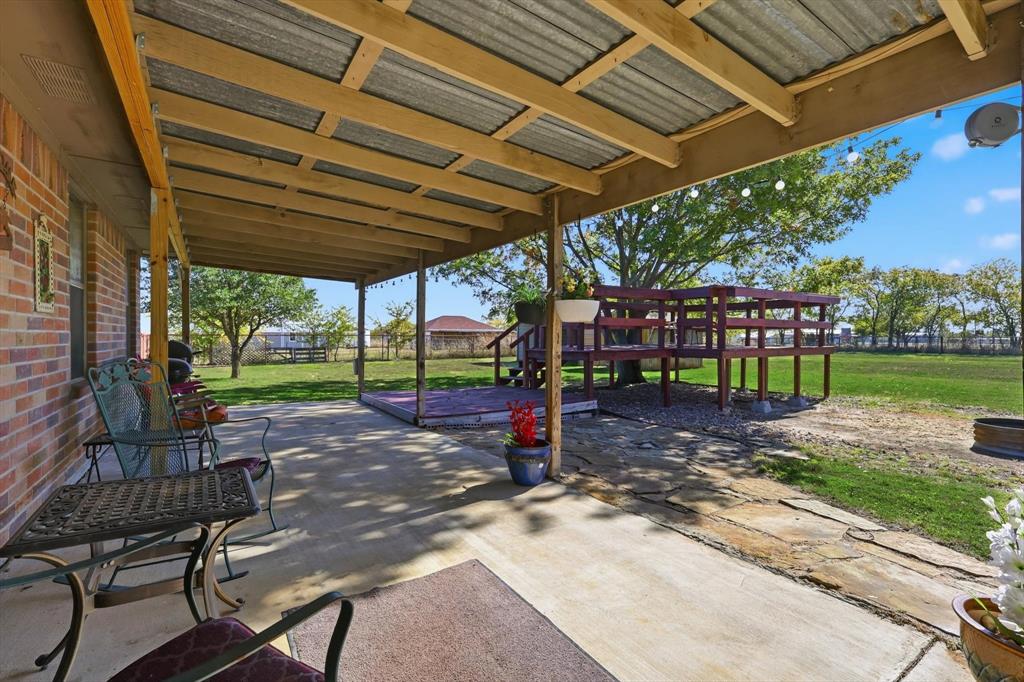 11649 Mitchell Circle Ponder, TX 76259 - Photo 24 of 38 a view of a backyard with sitting area